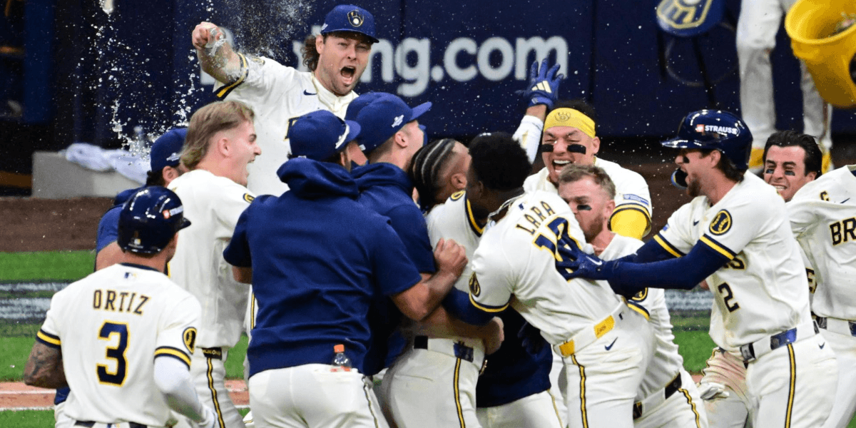 Baseball team celebrating a victory with excitement and champagne in a stadium setting