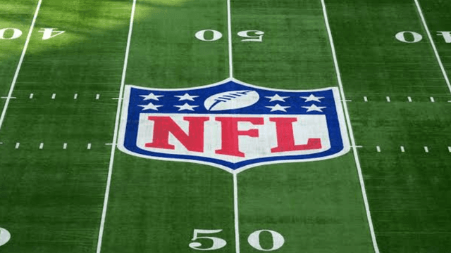 NFL logo centered on a green football field with yard markers visible
