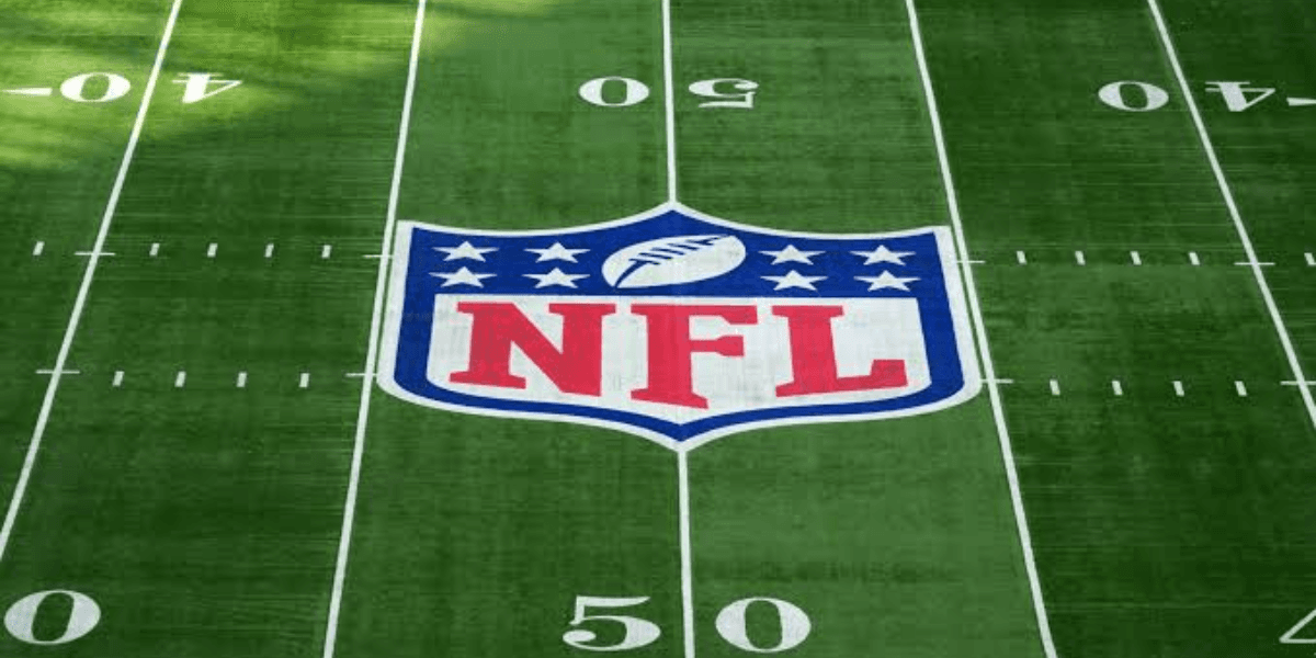 NFL logo centered on a green football field with yard markers visible