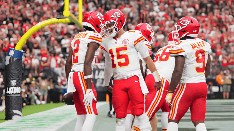 Kansas City Chiefs players celebrate a touchdown on the football field